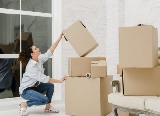 woman-sorting-boxes-after-relocation woman-sorting-boxes-after-relocation